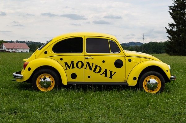 yellow bettle car with Monday written on it