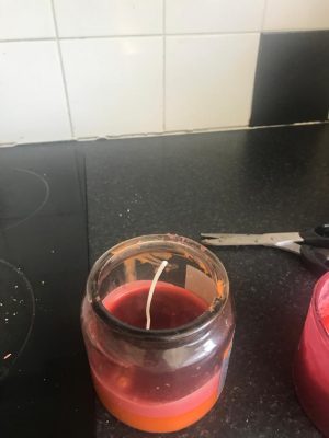 wick in red and orange wax 